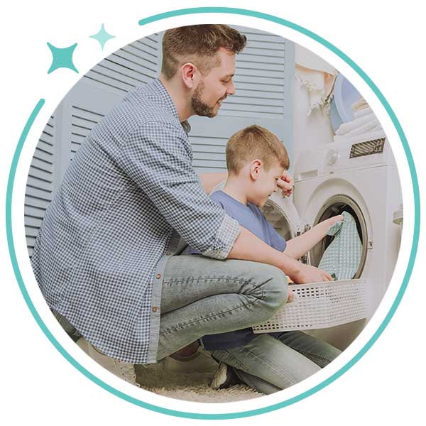 Au pair and Child Doing laundry